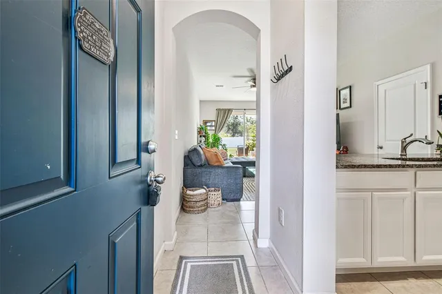 a kitchen with stainless steel appliances granite countertop a sink and a white cabinets