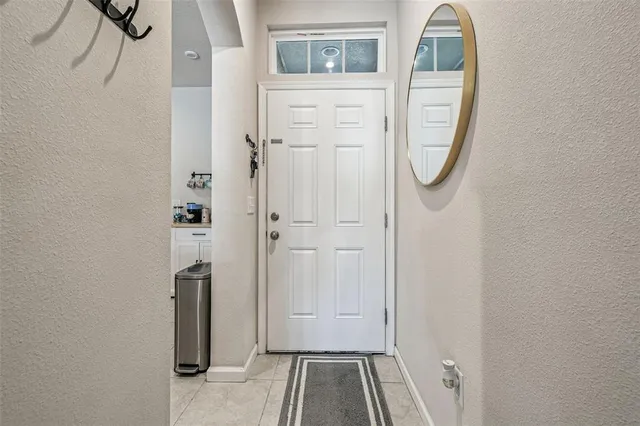 a kitchen with a sink a stove top oven and cabinets