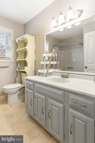 a bathroom with a toilet and a bathtub