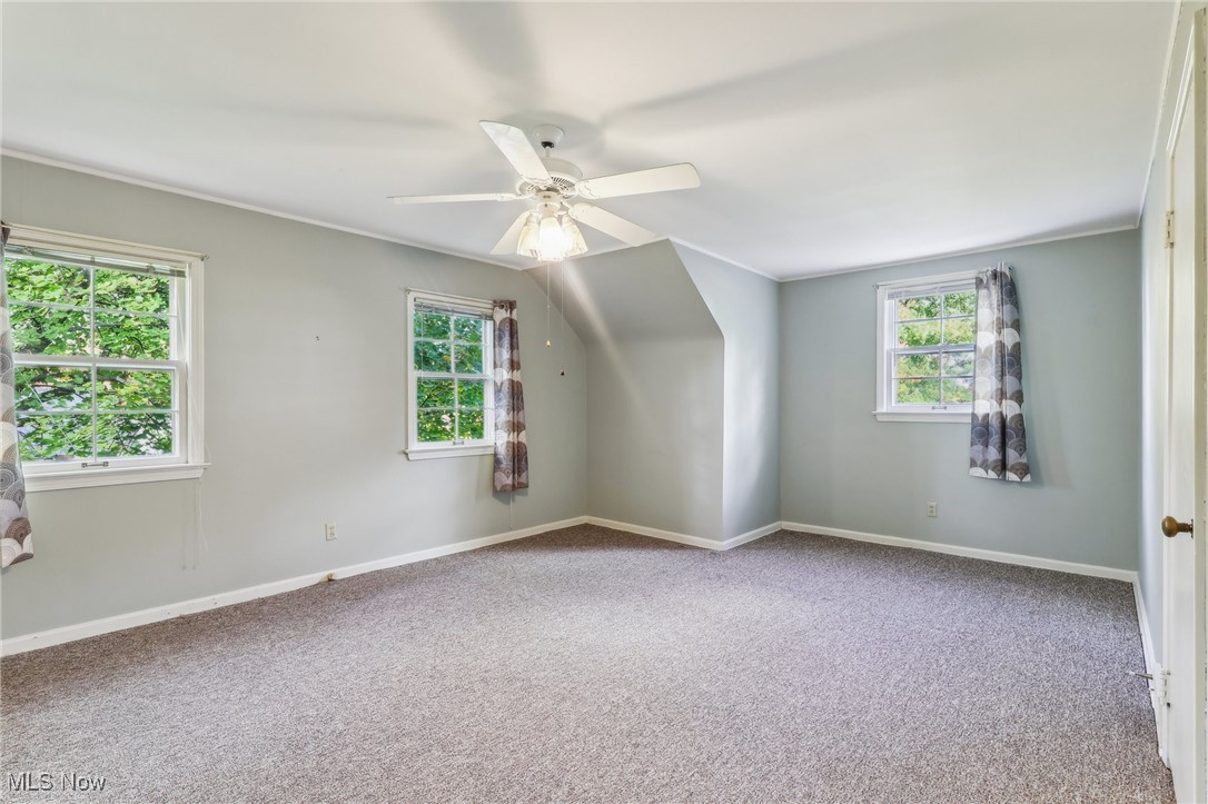 4476 College Road South Euclid, OH 44121 - Photo 14 of 42 Additional living space featuring carpet and ceiling fan