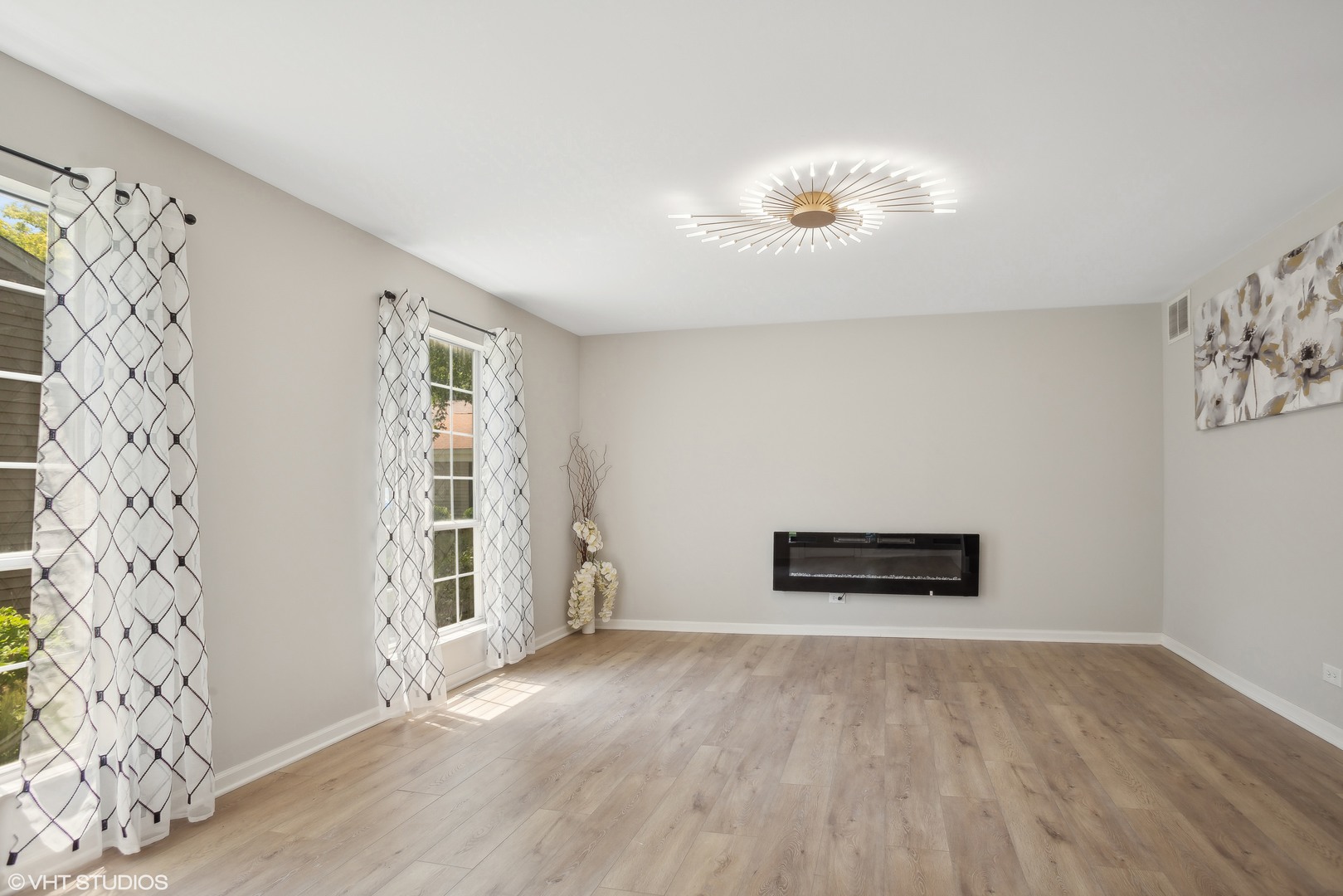 16 Forest Lane Cary, IL 60013 - Photo 3 of 18 wooden floor in an empty room with a window