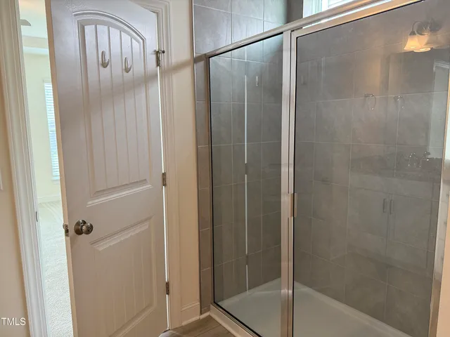 a view of a livingroom with a ceiling fan and window