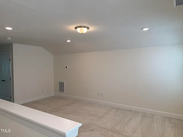 a bathroom with a granite countertop sink and mirror