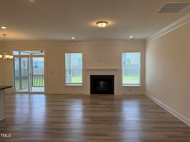 a picture of a bench in front of a building