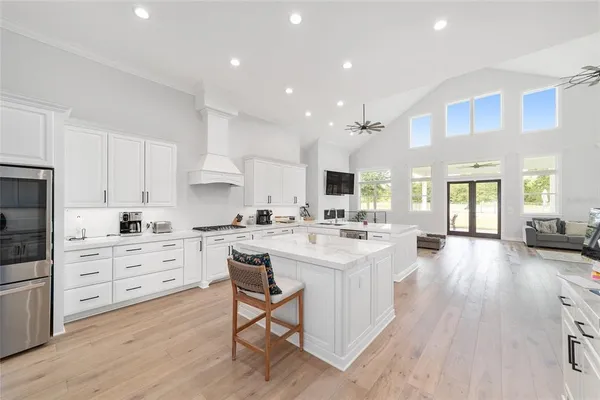 a view of a dining area kitchen with a table and chairs