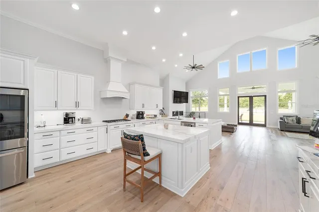 a view of a dining area kitchen with a table and chairs