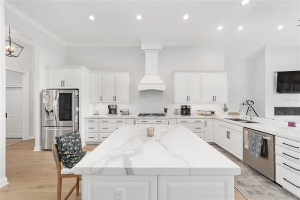 a kitchen with a sink stove and refrigerator