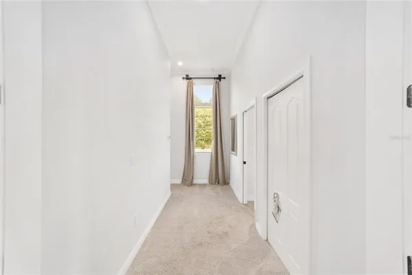 a bed room with a bed and a ceiling fan