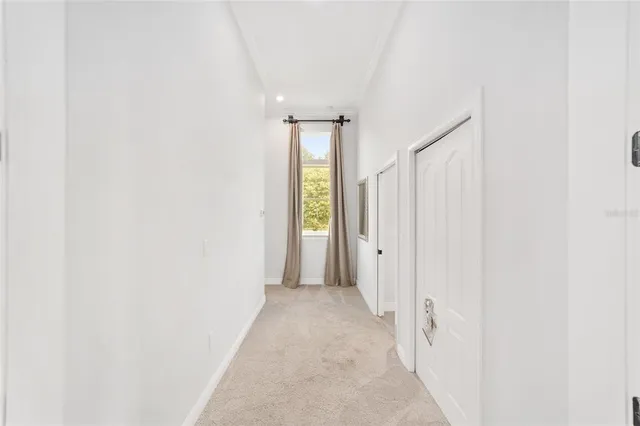 a bed room with a bed and a ceiling fan