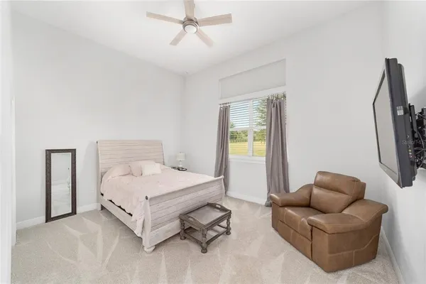a bathroom with a double vanity sink a toilet and a mirror