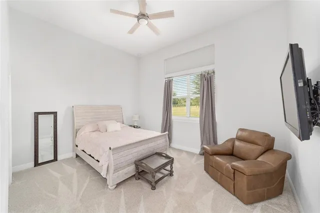 a bathroom with a double vanity sink a toilet and a mirror