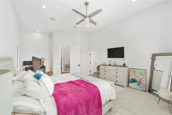 a bedroom with bed and a window