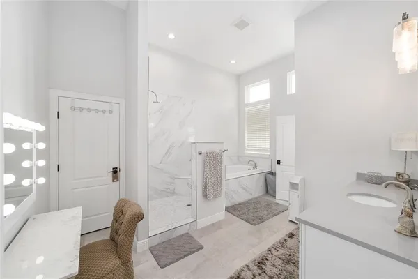 a living room with furniture ceiling fan and a window