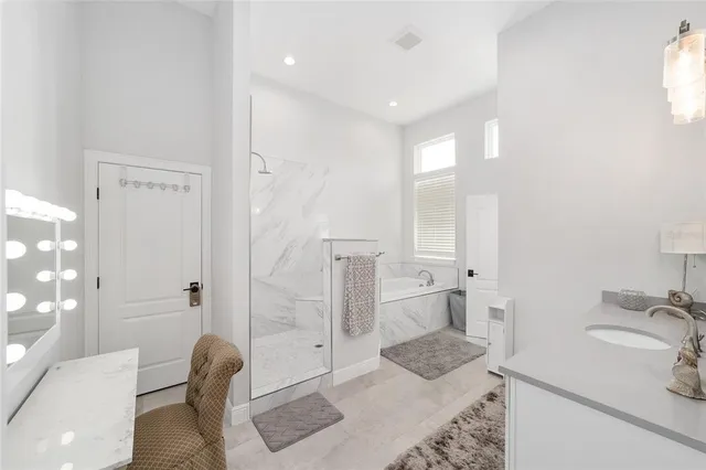 a living room with furniture ceiling fan and a window