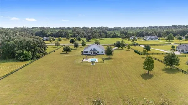 a view of a lake with houses in the back