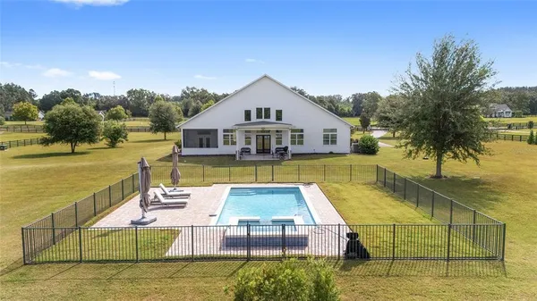 a view of a swimming pool with a patio