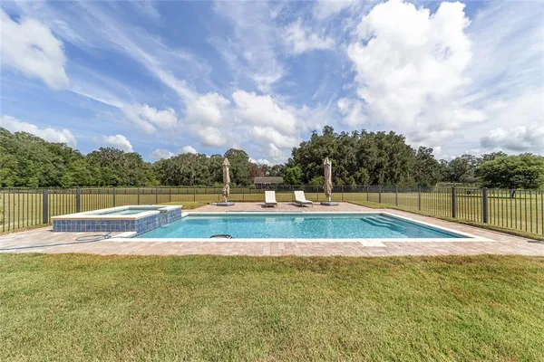 a view of a swimming pool with an outdoor space