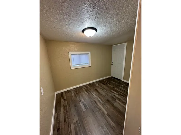 a view of a livingroom with wooden floor
