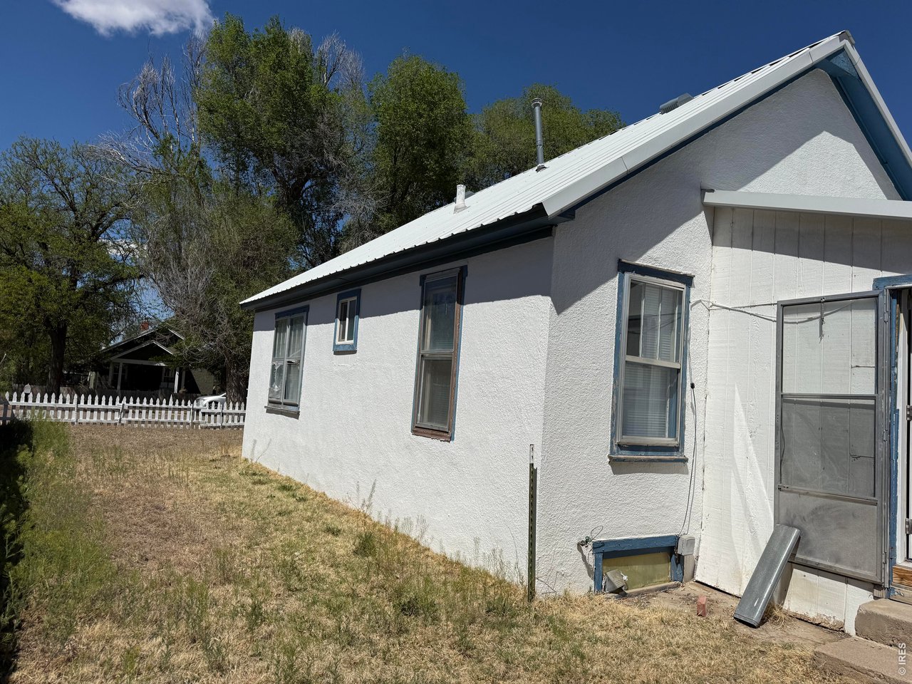 709 South 3rd Street Lamar, CO 81052 - Photo 20 of 20 a backyard of a house with table and chairs