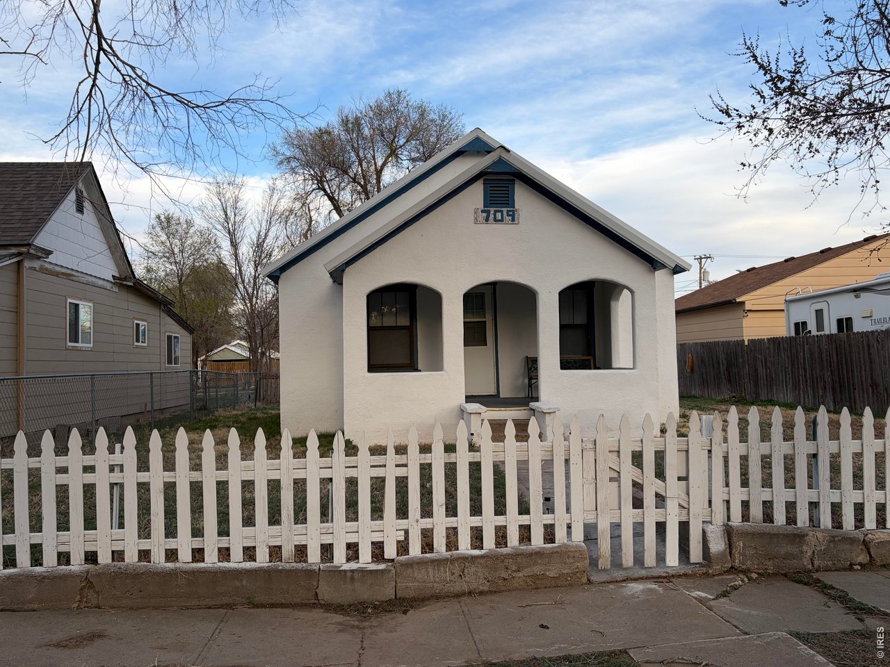 709 South 3rd Street Lamar, CO 81052 - Photo 2 of 20 a view of a house with a small yard