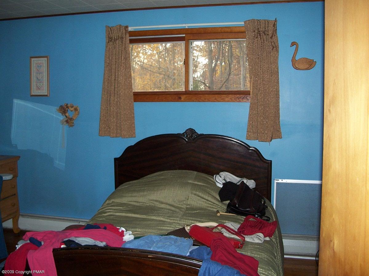 137 Independence Road East Stroudsburg, PA 18301 - Photo 12 of 15 a bedroom with a bed and a window