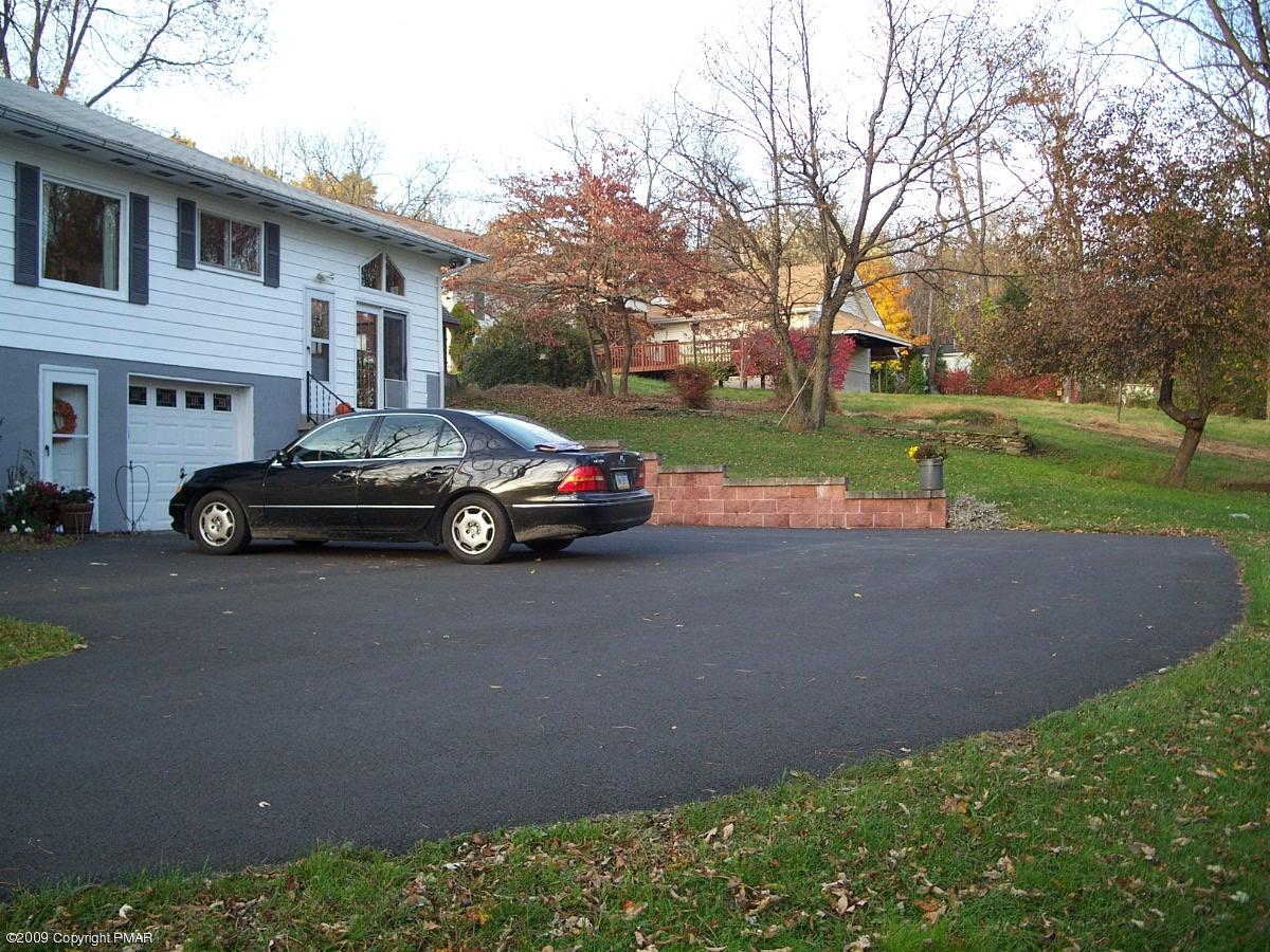 137 Independence Road East Stroudsburg, PA 18301 - Photo 3 of 15 a car parked in front of a house next to a yard