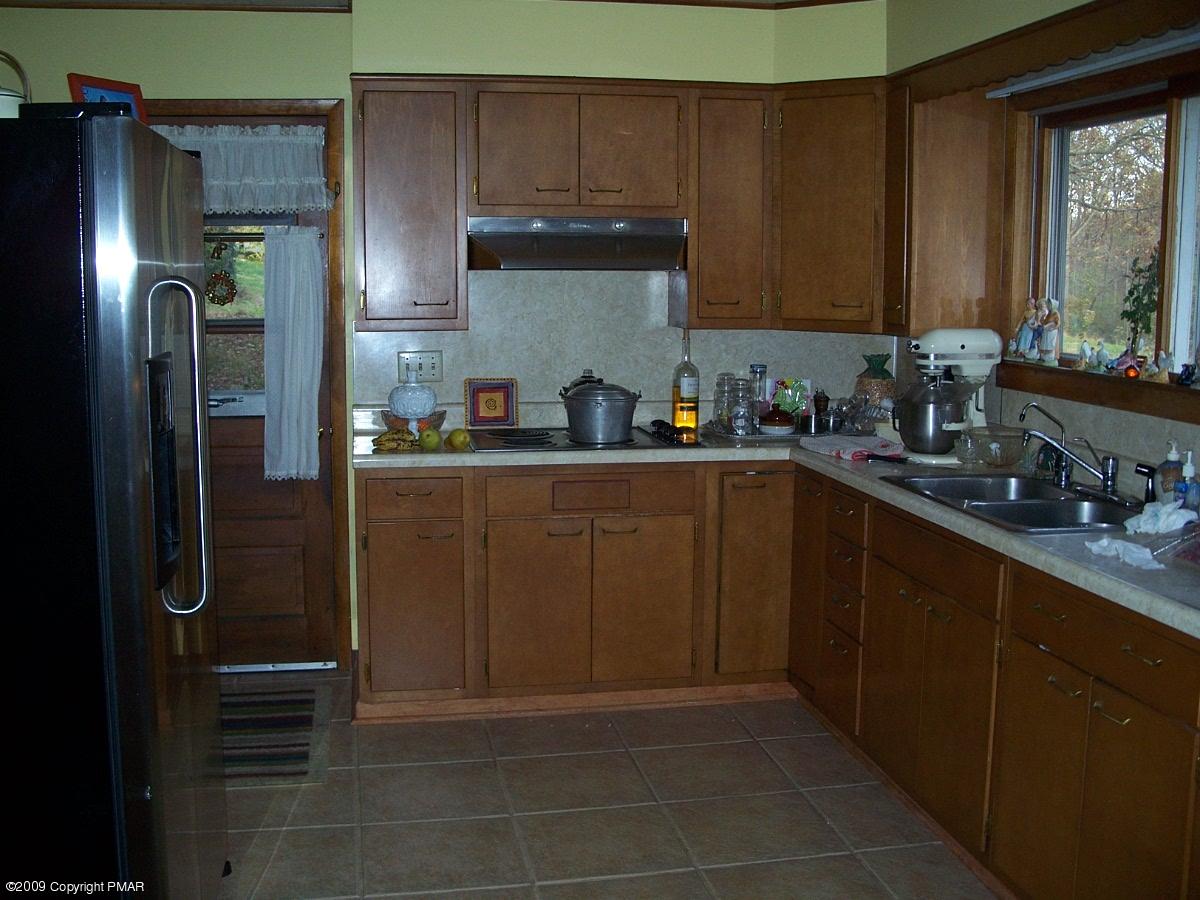 137 Independence Road East Stroudsburg, PA 18301 - Photo 8 of 15 a kitchen with stainless steel appliances granite countertop a refrigerator and a sink
