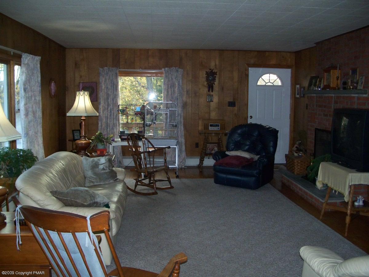 137 Independence Road East Stroudsburg, PA 18301 - Photo 10 of 15 a living room with furniture and a chandelier