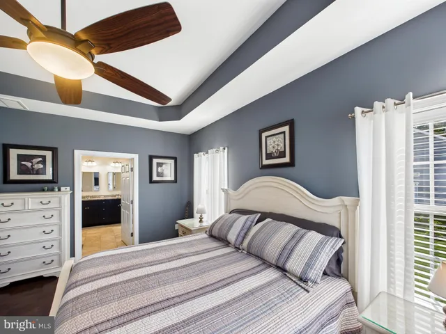 a bedroom with a large bed and a dresser