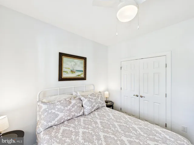 a bedroom with a bed and a lamp