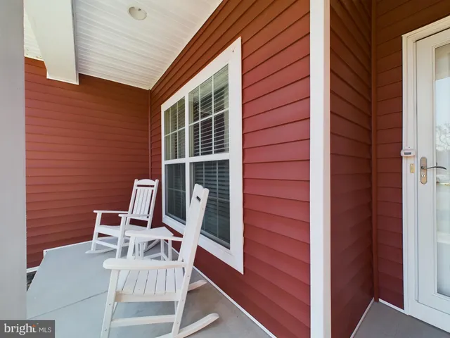 a view of a chair and table in the balcony