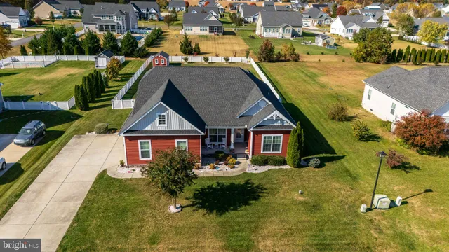 an aerial view of a house with a swimming pool yard and outdoor seating