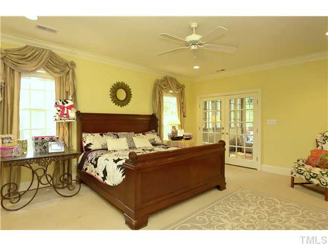 323 Marlowe Road Raleigh, NC 27609 - Photo 11 of 25 a bed room with a bed and a chair