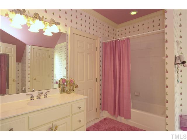 323 Marlowe Road Raleigh, NC 27609 - Photo 17 of 25 a bathroom with a sink vanity mirror and shower