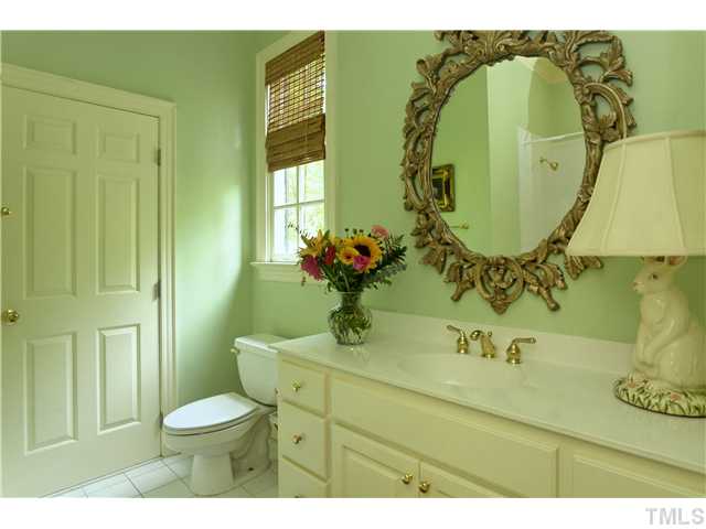 323 Marlowe Road Raleigh, NC 27609 - Photo 9 of 25 a bathroom with a sink mirror and toilet