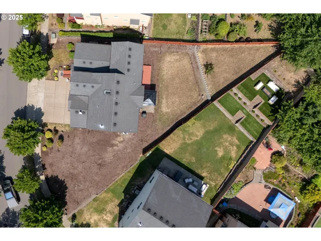 an aerial view of house with a yard