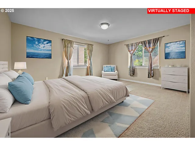 a bedroom with a bed and a large window