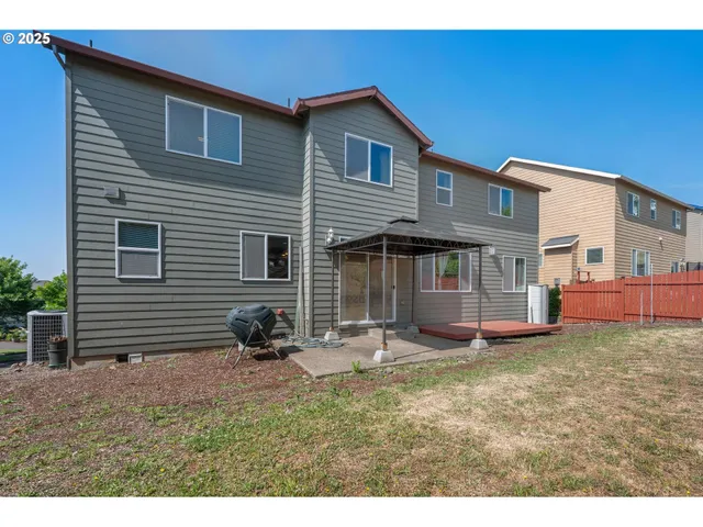 a backyard of a house with seating space