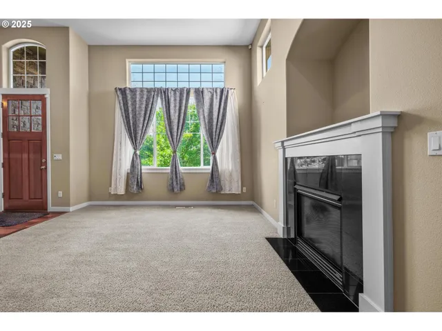 a view of empty room with floor and window