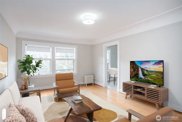 a living room with furniture and a flat screen tv