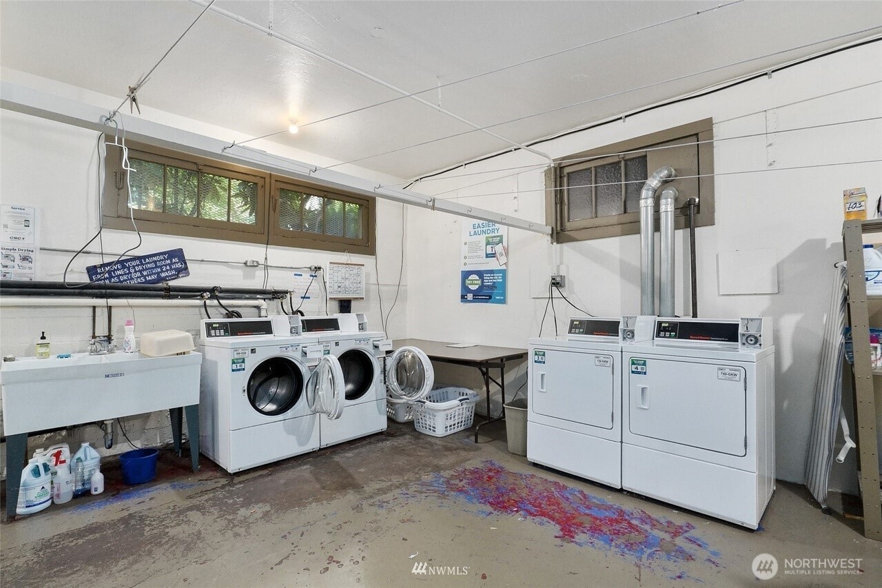1605 East Olive Street, Unit 307 Seattle, WA 98122 - Photo 18 of 21 a utility room with dryer and washer