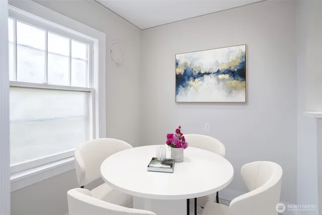 a dining room with furniture and window