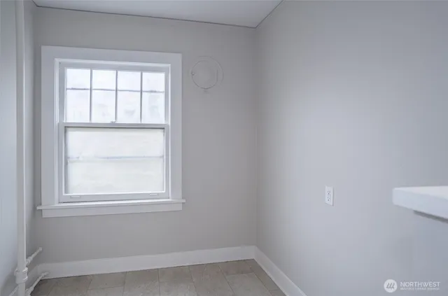a view of an empty room with a window