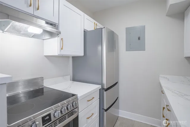 a kitchen with stainless steel appliances a refrigerator and a stove