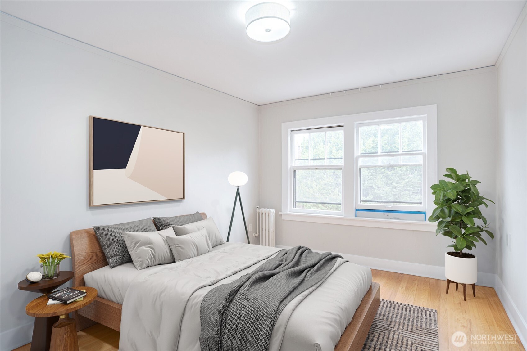 1605 East Olive Street, Unit 307 Seattle, WA 98122 - Photo 10 of 21 a bedroom with a bed and a window