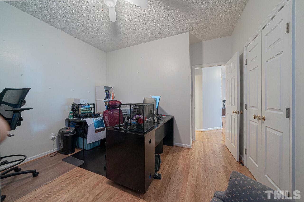 6901 Brigmore Court Raleigh, NC 27617 - Photo 14 of 25 a view of a workspace with furniture and wooden floor