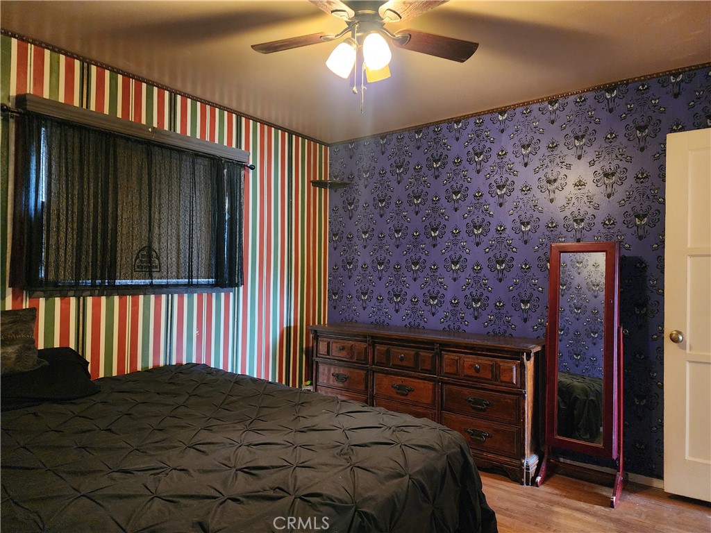 505 South Paula Drive Fullerton, CA 92833 - Photo 11 of 20 a bedroom with a bed and a chandelier