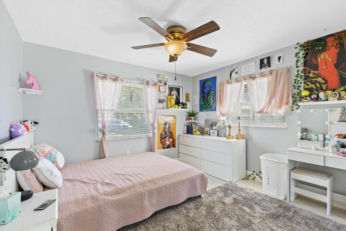 640 27th Street Southwest Naples, FL 34117 - Photo 14 of 37 a bedroom with a bed and a window