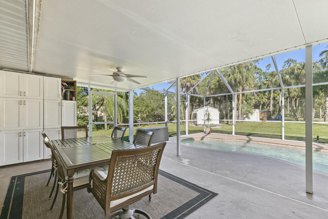 640 27th Street Southwest Naples, FL 34117 - Photo 15 of 37 a patio with yard glass top table and chairs
