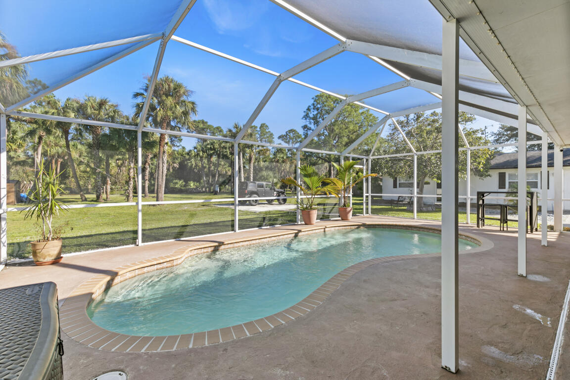 640 27th Street Southwest Naples, FL 34117 - Photo 16 of 37 a view of a swimming pool with a porch